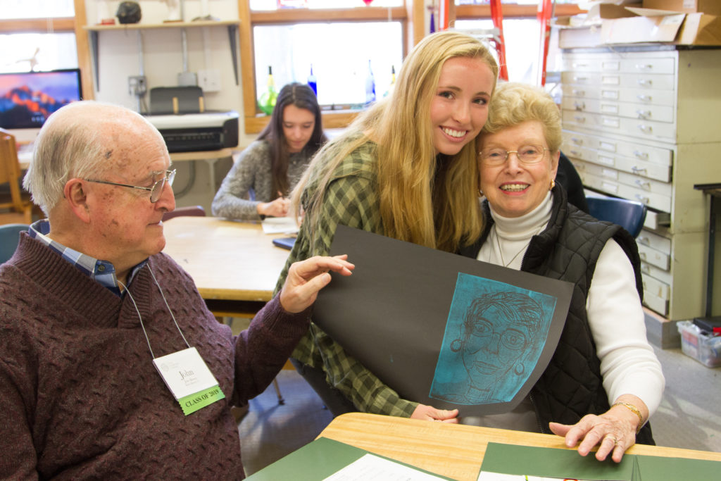 Students cut out prints of their grandparents and printed portraits in art class.