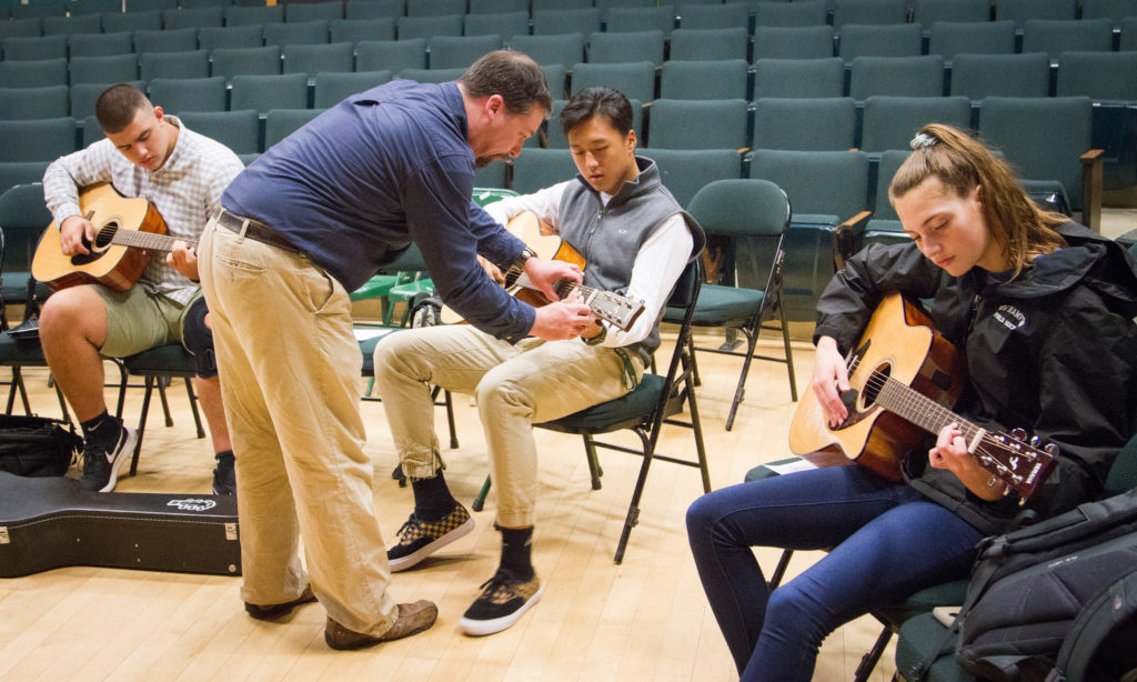 New Hampton Students learn to play the guitar from one of their outstanding teachers.