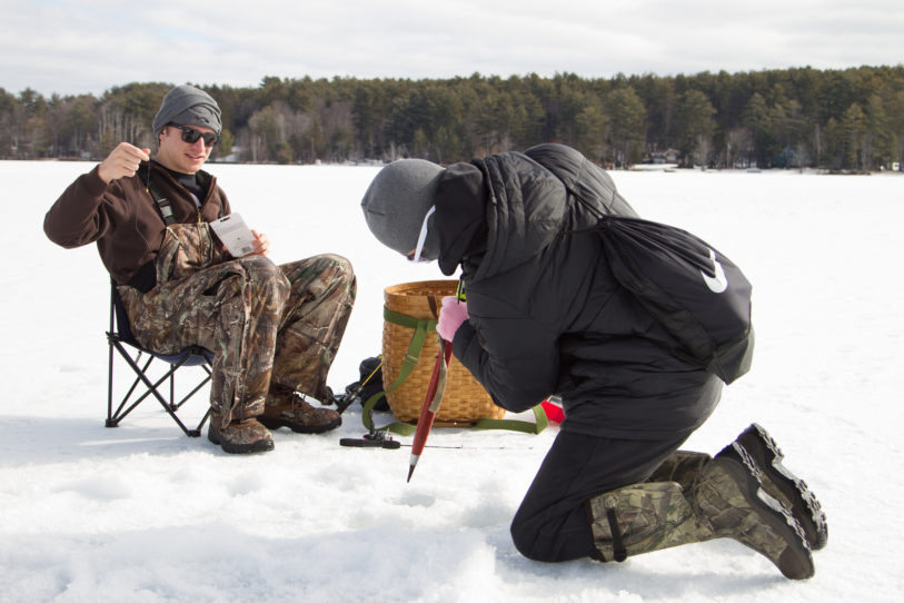 Students ice fishing on a nearby lake in New Hampshire