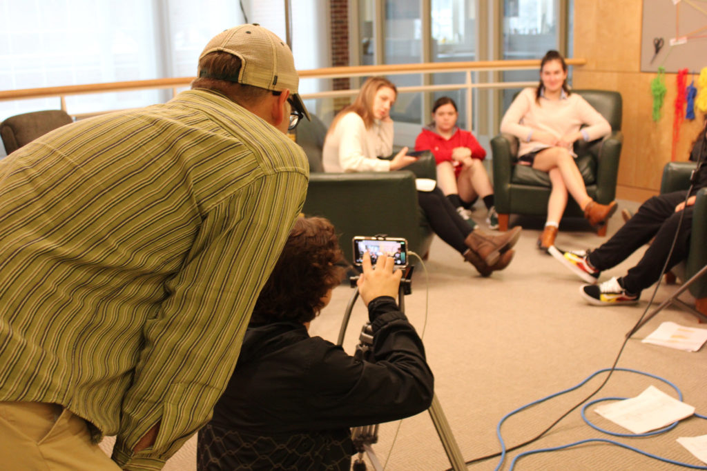 Students filming.