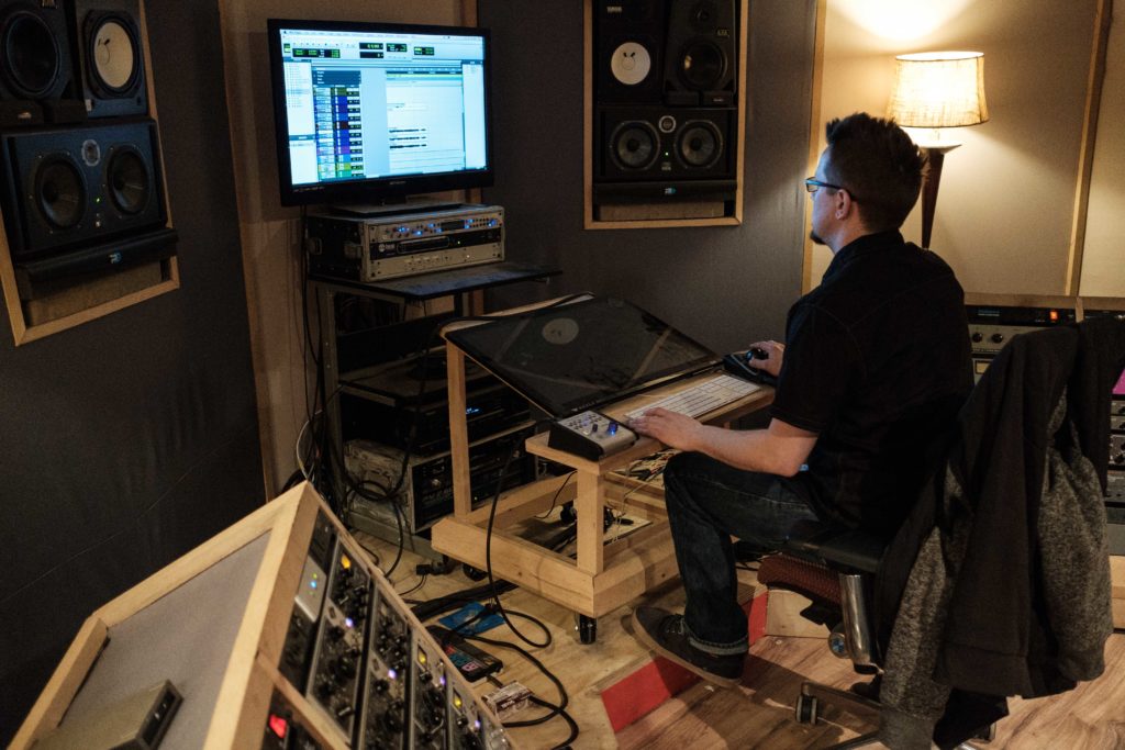 Sound engineer in the studio control room.