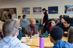 Alumni in Residence Thomas Motley with students at lunch