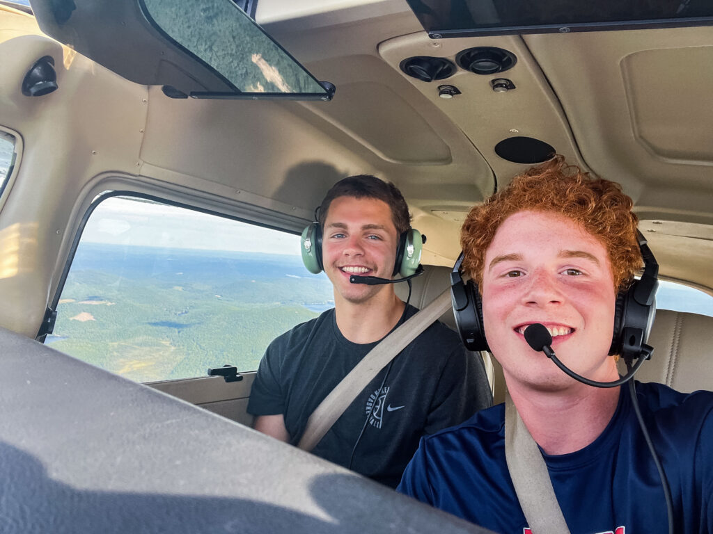 Young pilot Harry '22 (right) mid-flight with fellow Husky Joe Joe '22.